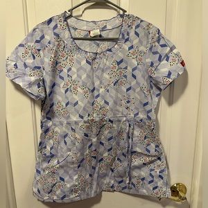 This is a Dickies scrub top.  Fits like a small.